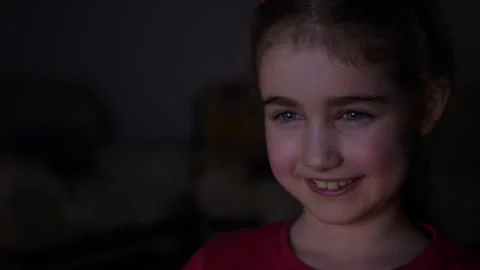 Child Watching TV, Close up Face of Little Girl, Kid Eyes. Portrait Laughin.. Video stock 336003336