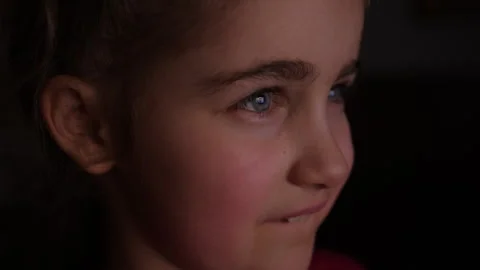 Child Watching TV, Close up Face of Little Girl, Kid Eyes. Portrait Laughin.. Video stock 336003931