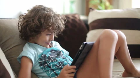 Child watching videos on a tablet computer Stock Footage 54405655