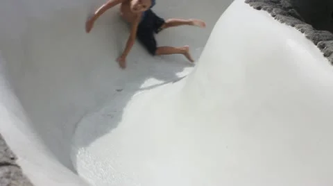 Child on water slide Stock Footage 11633596