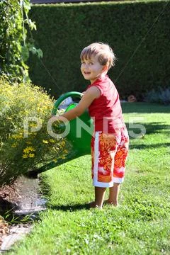 Child with watering can Stock Photos