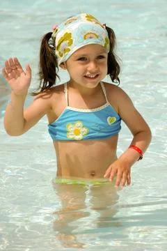 Child waving in pool Stock Photos