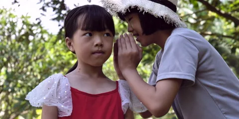 Child whisper slow motion Stock Footage 162111309