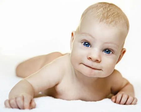 A child on a white background with blue eyes Stock Photos