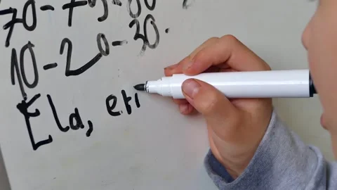 A child who has just started primary school and is just learning the alphab.. Stock Footage 257903710