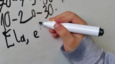 A child who has just started primary school and is just learning the alphab.. Stock Footage 257904998