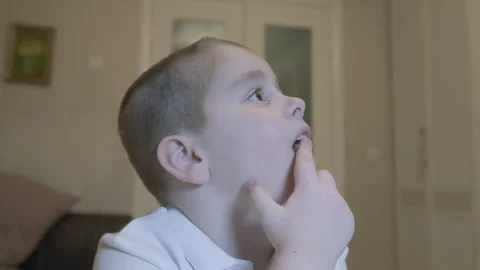 Child Wiggling His Front Milk Teeth. Child Showing His Milk Tooth Before Losing Stock Footage 304105648
