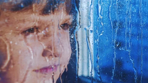 The child by the window. The child is the rain. Stock Footage 88475298