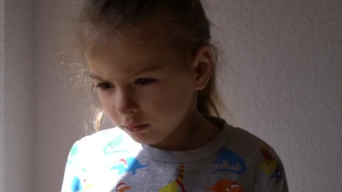 Child by the window Video stock 127449170