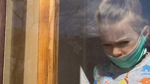 Child by the window Video stock 127449807