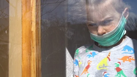 Child by the window Video stock 127449860