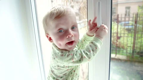 Child at the window Stock Footage 130348958