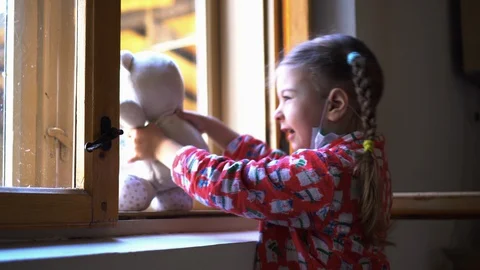 Child by the window with teddy bear. Stock Footage 128800938