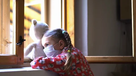 Child by the window with teddy bear. Stock Footage 128809296