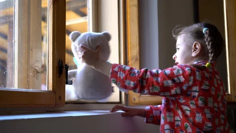 Child by the window with teddy bear. Stock Footage 128812199