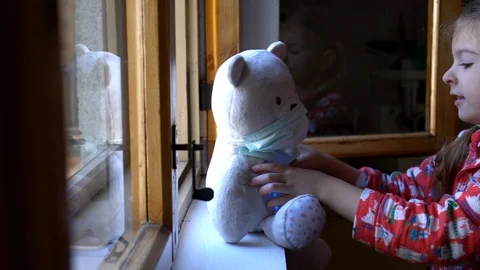 Child by the window with teddy bear. Stock Footage 128815902