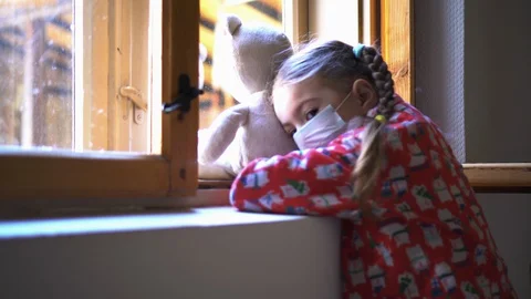 Child by the window with teddy bear. Stock Footage 128824175