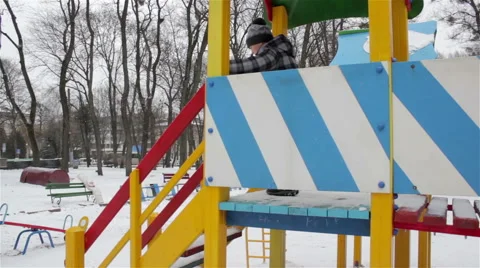 Child on winter playground Stock Footage 67880108