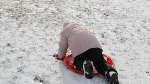 A child in winter plays in the snow in the mountains Stock Footage 124283448