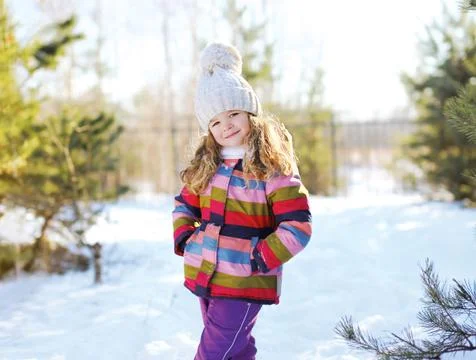 Child in winter sunny day Stock Photos