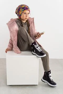 Child in winters clothes in studio Stock Photos