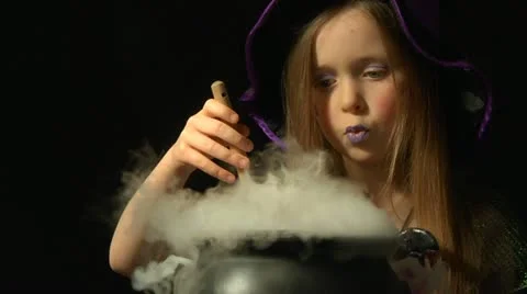 Child in witch costume Stock Footage 22664065