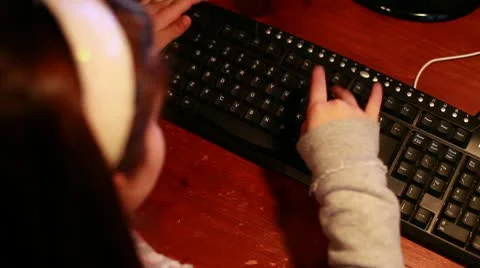A child write on keyboard Stock Footage 10590149