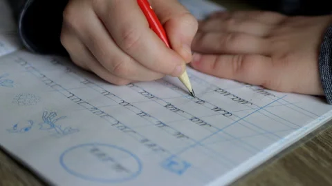 A child writes calligraphy in a notebook  Stock Footage 291318162