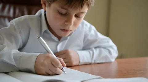 Child writes homework. Dolly shot Stock Footage 32248908