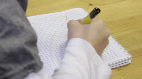 Child writes in notebook Video stock 36042380