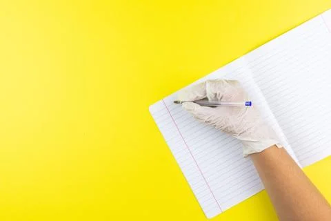The child writes on a notebook Stock Photos