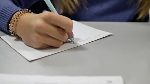 A child writes with a pen in a notebook Stock Footage 150233174