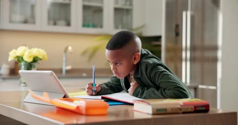 Child, writing and elearning in house with tablet, watch video and study for Stock Footage 341568549