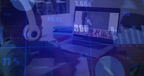 Child writing notebook in online class at home, with laptop showing teacher and Stock Footage 308658112