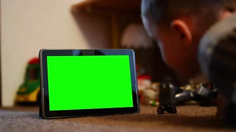 Child (young boy) look on tablet - green screen - closeup Stock-Footage 49855134