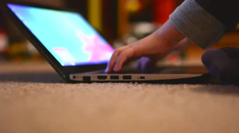 Child (young boy) works on notebook - closeup laptop (hands) Stock Footage 49856166