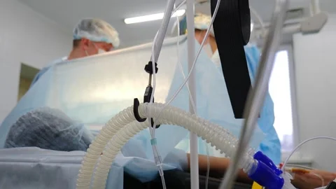 Childbirth by caesarean section. doctors surgeon performing incision on patient Stock Footage 317601896
