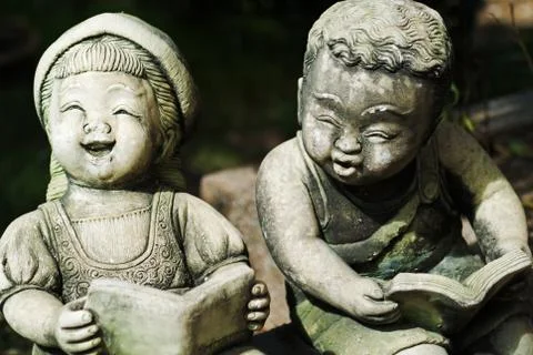 Childen stone reader Stock Photos