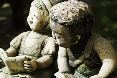 Childen stone reader Stock Photos