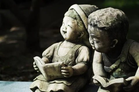 Childen stone reader Stock Photos