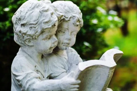 Childen stone reader Stock Photos