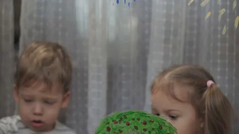 Childhood, creativity, nature, spring, summer concept - close-up of two little Video stock 145697967