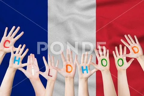 Childhood inscription on the children's hands against the background of a wav Stock Photos