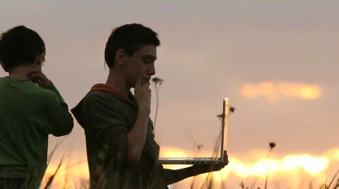 Childhood in nature, beautiful scene with laptop Stock Footage