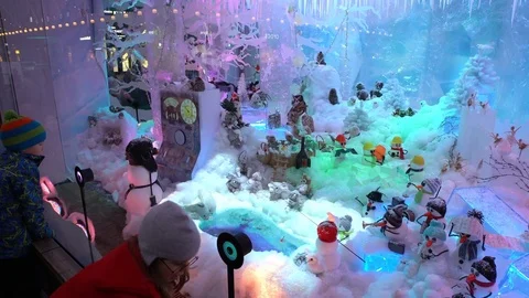 Children admiring the Christmas holiday window displays. Stock Footage