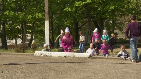 Children from Amish communities running down the street to class Stock-Footage 70162445
