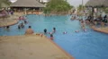 Children and adults swimming at Playa Blanca Resort, Panama 4k or 4k+ Resolution