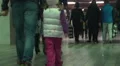 Children and adults walking through underpass, people traveling, slow-motion HD Footage