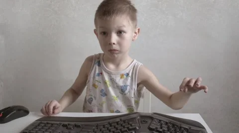 Children and computerization, child boy with the keyboard 스톡 동영상 59965340