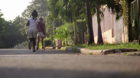 Children and fun, two happy young girls playing in city street Stock Footage 22762075